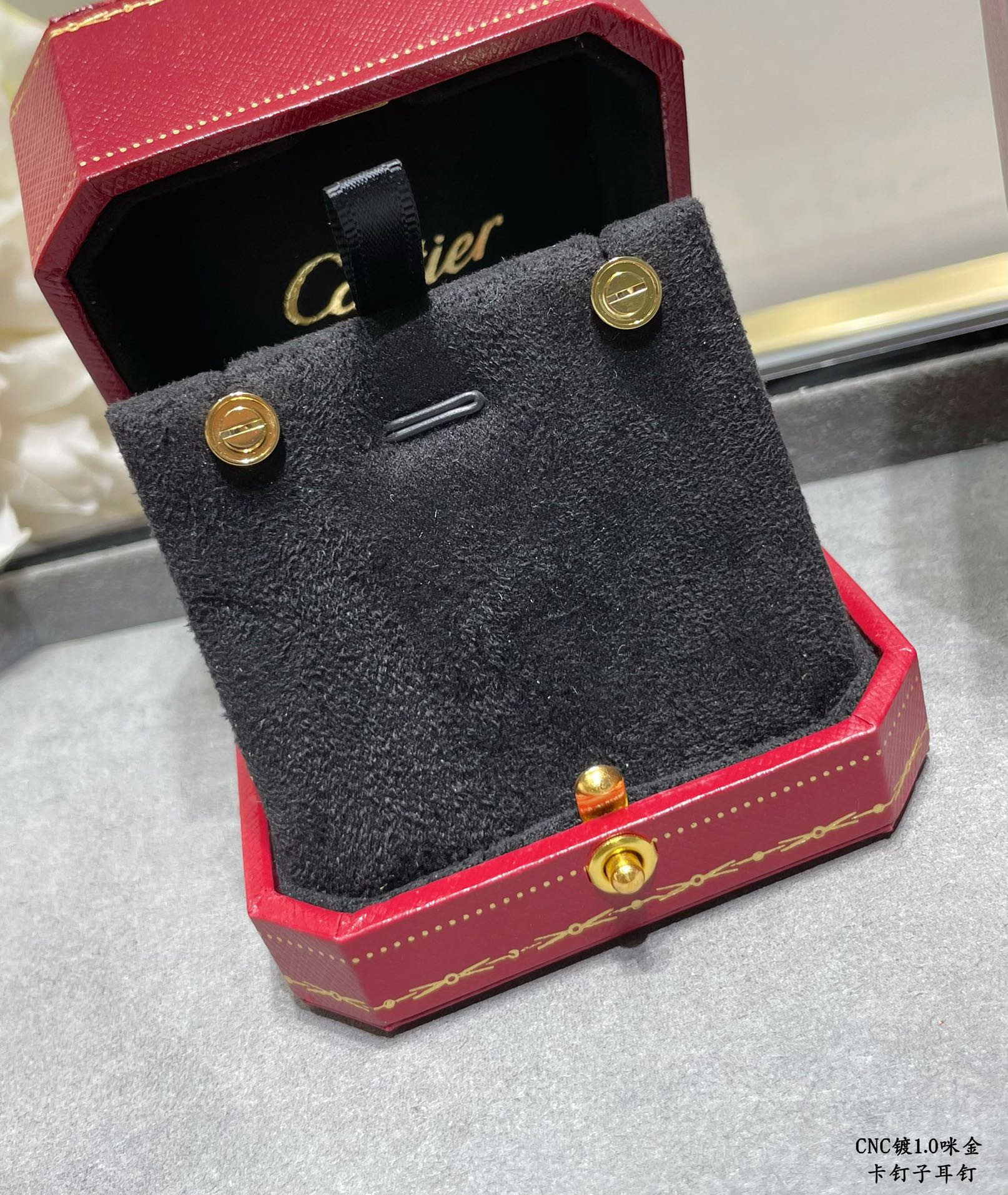 Ca*t1er nail earrings