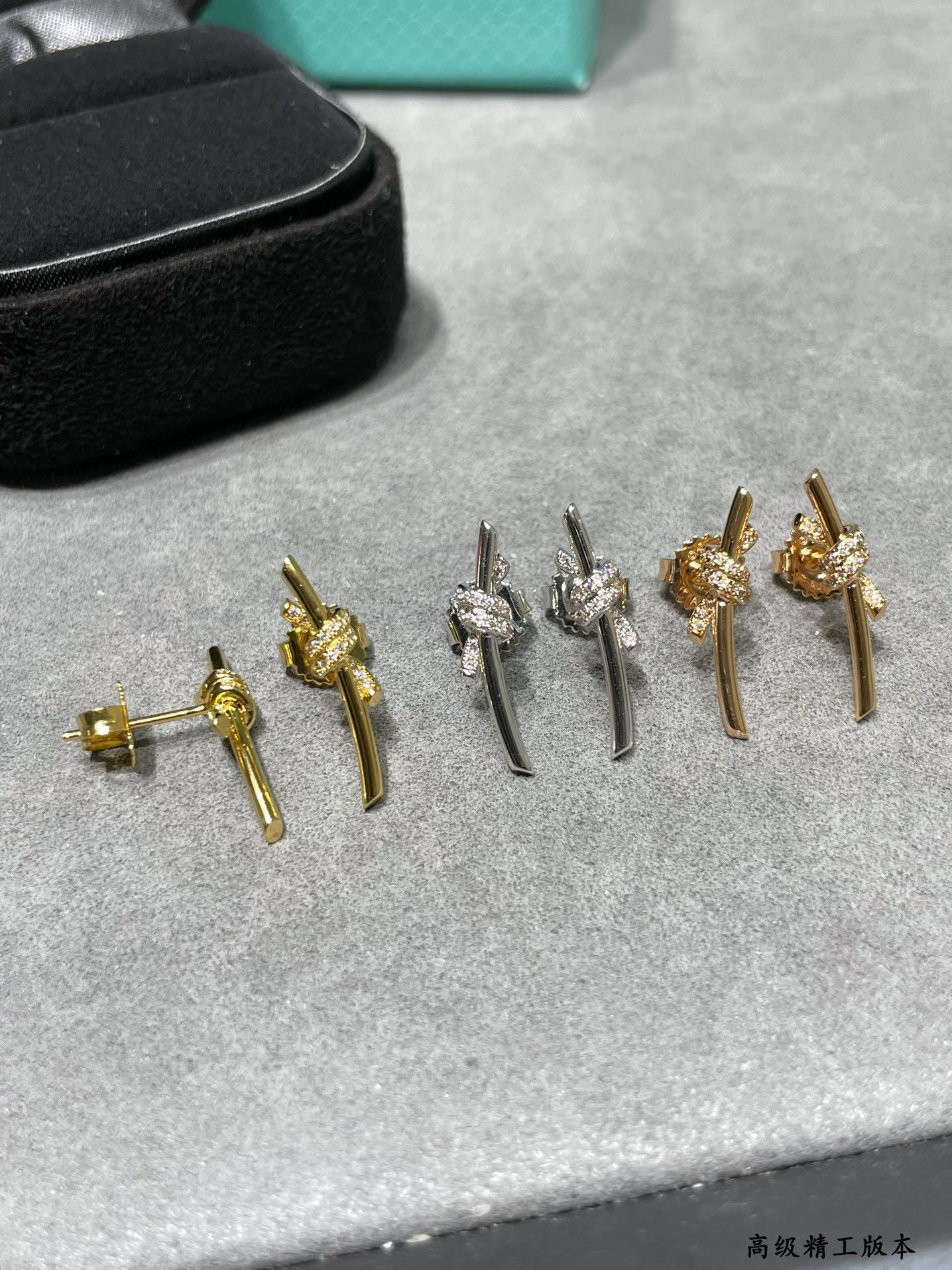 T*f*ny & Co. Half-D1am0nd T Wire Knot Stud Earrings