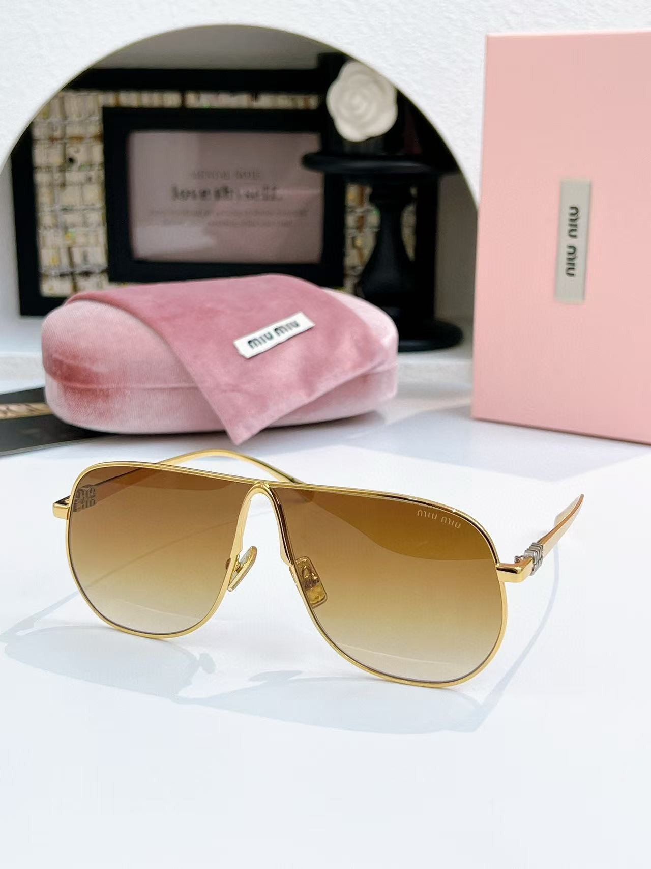 Miu Miu Glasses SMUA56