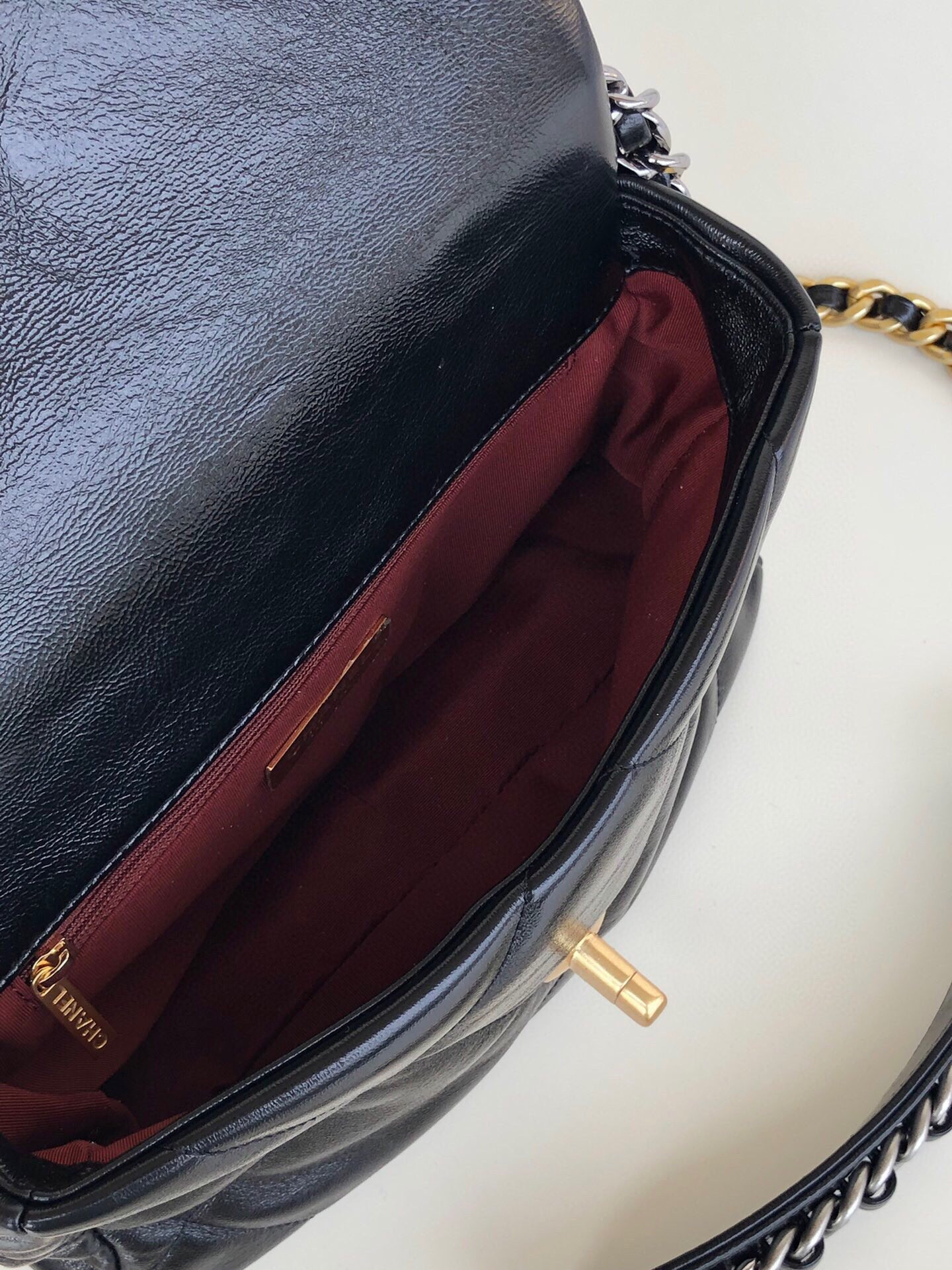 Ch**el 19 HANDBAG Shiny Leather, Gold-Tone, Silver-Tone & Ruthenium-Finish Metal Black 6.2 × 10.1 × 3.5 in