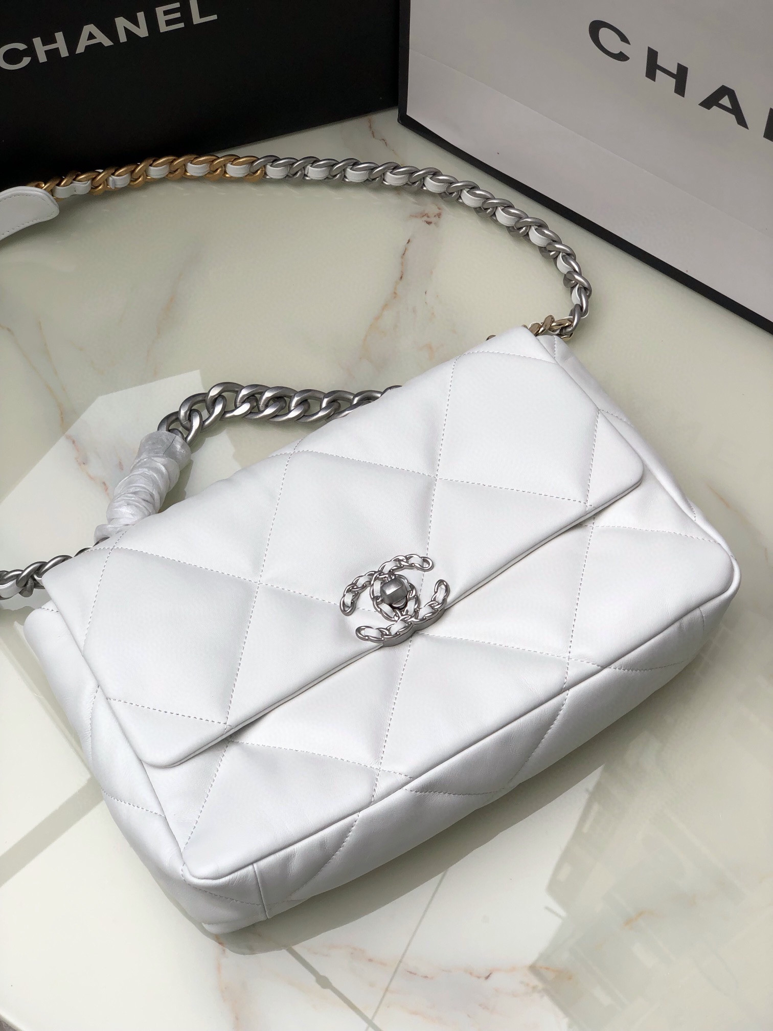 Ch**el 19 LARGE HANDBAG Shiny Leather, Gold-Tone, Silver-Tone & Ruthenium-Finish Metal White 7.8 × 11.7 × 3.9 in