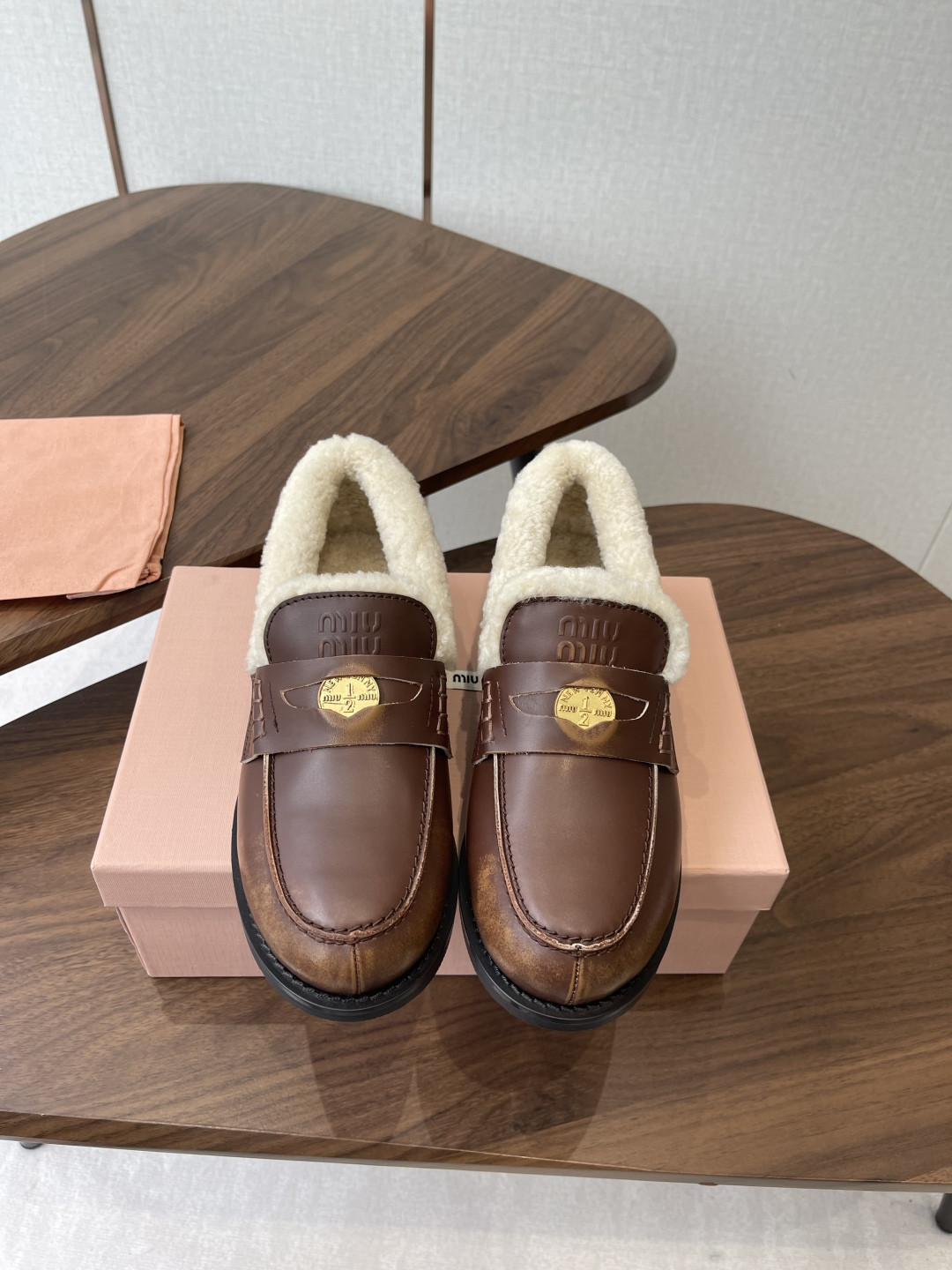 UA Miu Miu Bleached Leather and Shearling Penny Loafers